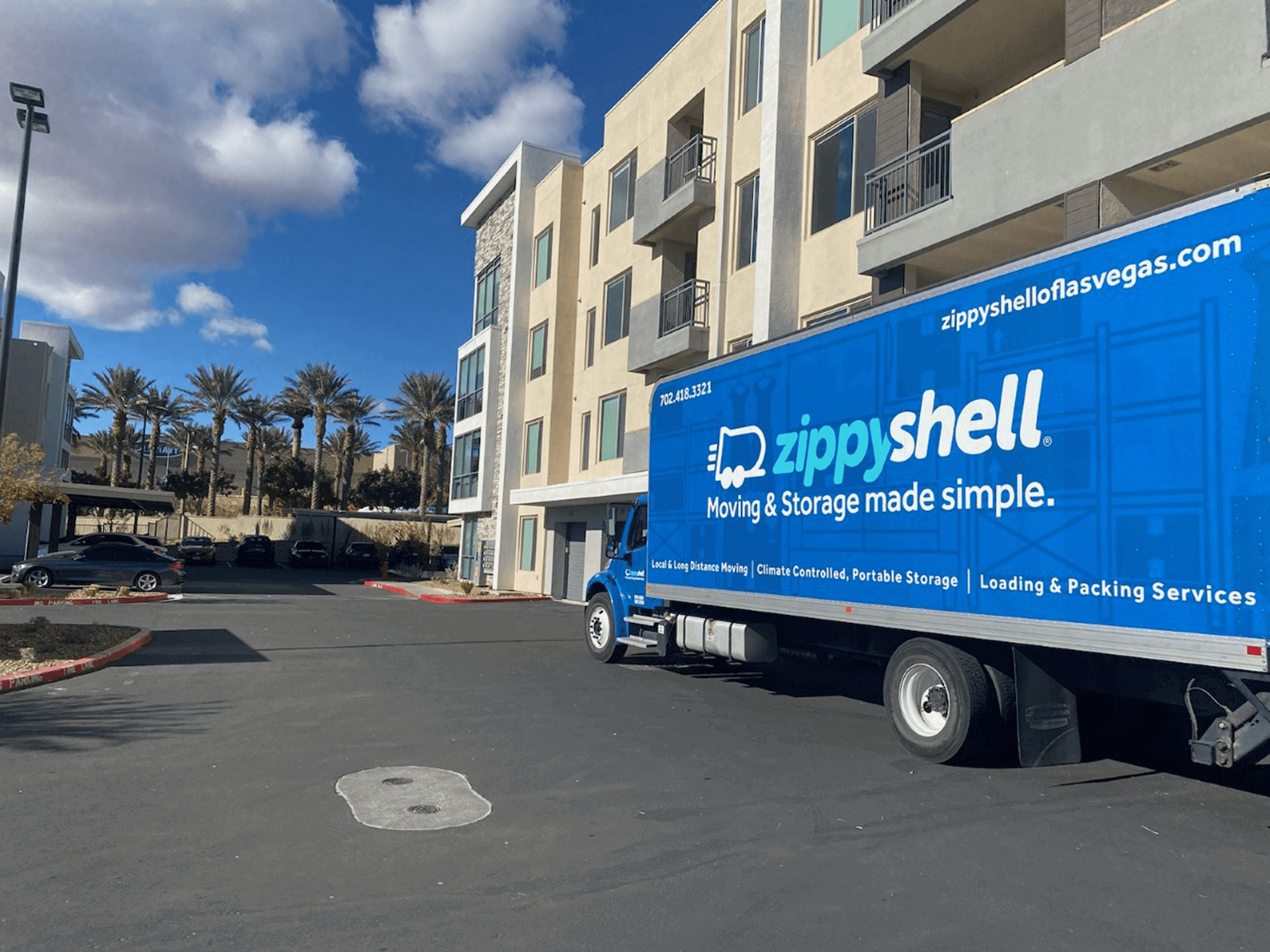 zippy shell truck parked outside apartment homes
